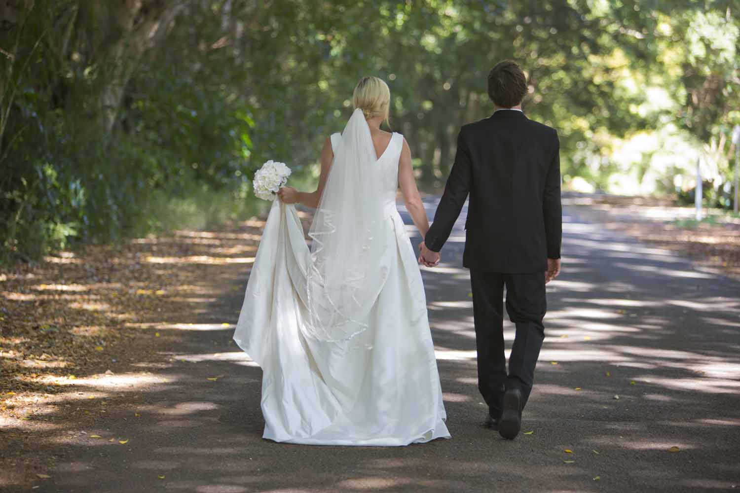 Newly Married Couple Holding Hands